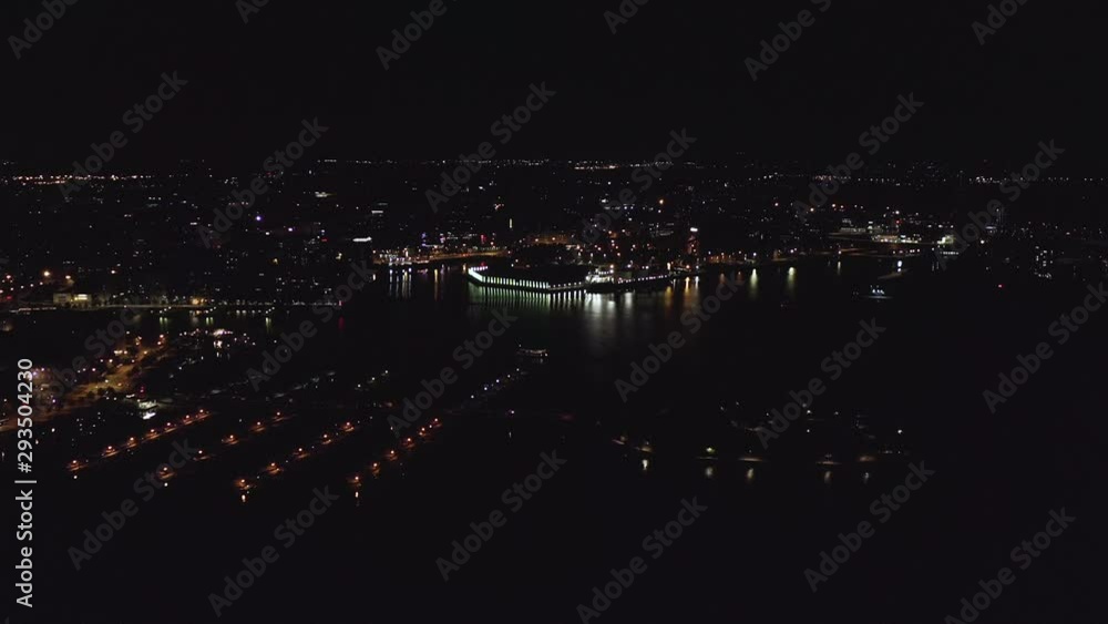 Aerial, tracking, drone shot, panning around the Helsinki north harbor, overlooking Kruununhaka, Tervasaari, Merihaka and Sompasaari, the city full of lights, in Uusimaa, Finland Aerial, tracking, drone shot, panning around the Helsinki north harbor, overlooking Kruununhaka, Tervasaari, Merihaka and Sompasaari, the city full of lights, in Uusimaa, Finland