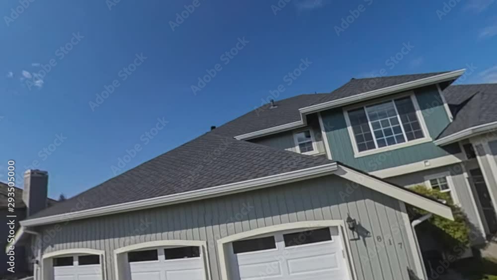 Zooming away from a modern American suburban house Zooming away from a modern American suburban house