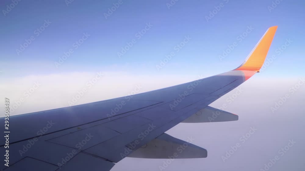 wing of a passenger plane in the sky. wing of a passenger plane in the sky.