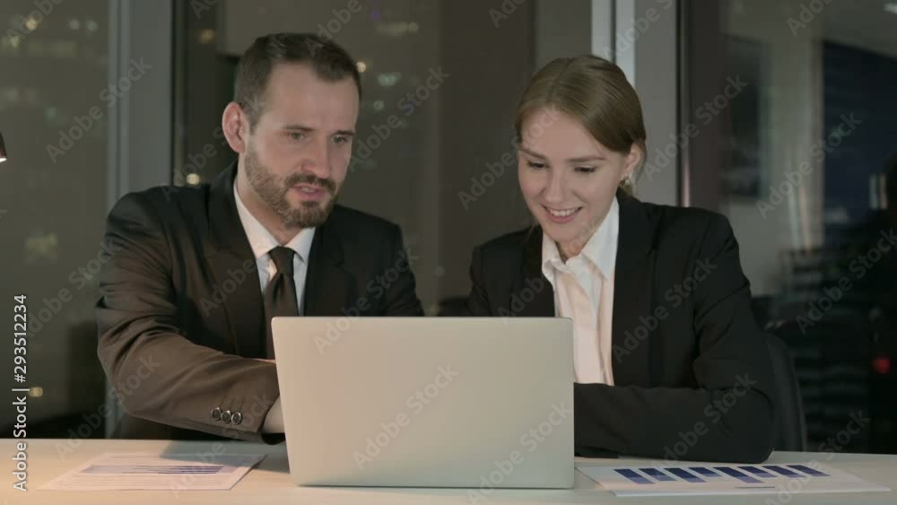 Executive Business people Sharing Idea on Laptop at Night Executive Business people Sharing Idea on Laptop at Night