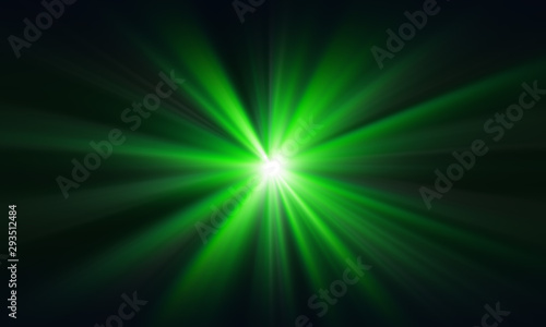 Green laser beam on a dark background