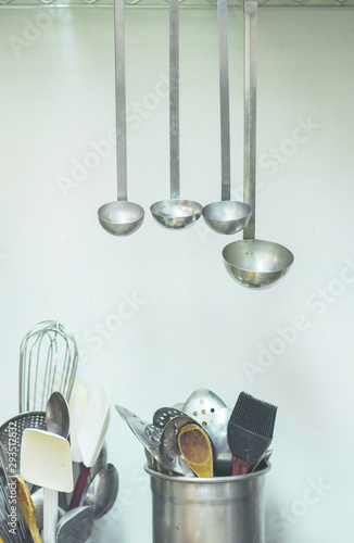industrial kitchen tools, large ladles hanging