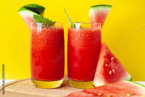 Vitamin watermelon smoothie for vegans on a yellow background. Super food for detox