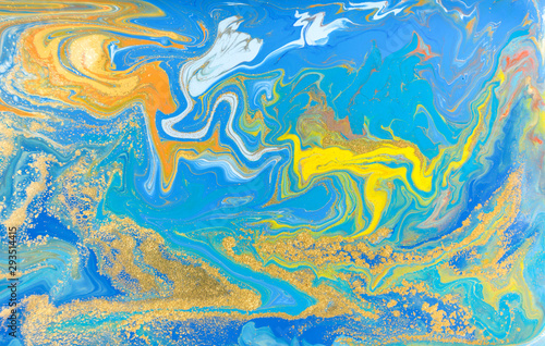 Blue and yellow marble pattern with golden glitter. Abstract liquid background