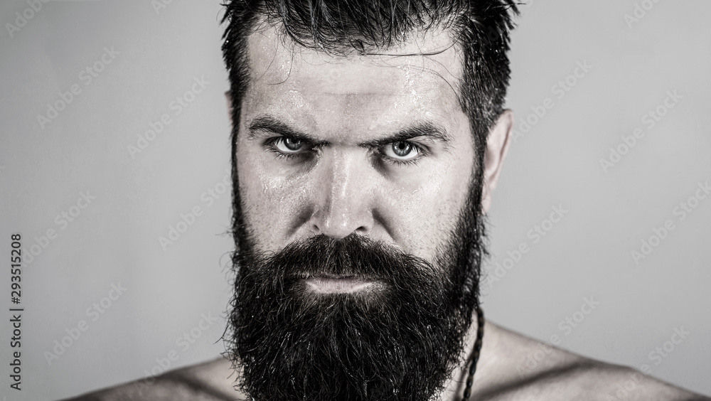 Obraz premium Handsome brutal male. Portrait of masculinity. Portrait brutal bearded man. Sexy closeup portrait of brutal handsome male, black beard. Sexy look of male. Hipster man with beard, sexy. Black and white