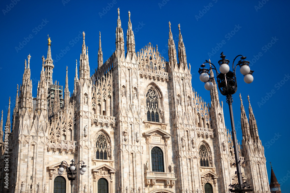 Duomo Di Milano - Cathedral (catholic church) is one of the world's largest building in the country. Close-up view of  marble details and statues on the exterior building. Milan, Lombardy, Italy.