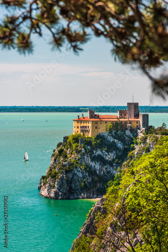 Fototapeta Naklejka Na Ścianę i Meble -  Gulf of Trieste. High cliffs Between boats, karst rocks and ancient castles. Duino. Italy