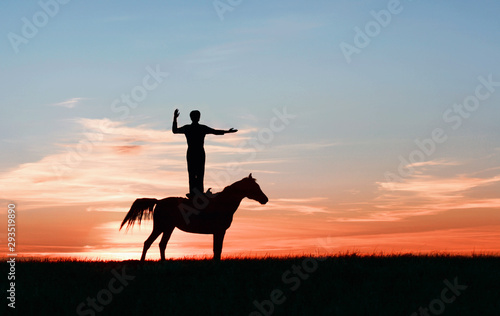 Yoga on horse  trick riding man shows direction