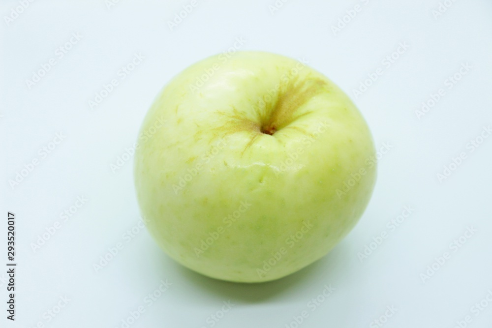 Green apple located on a white background