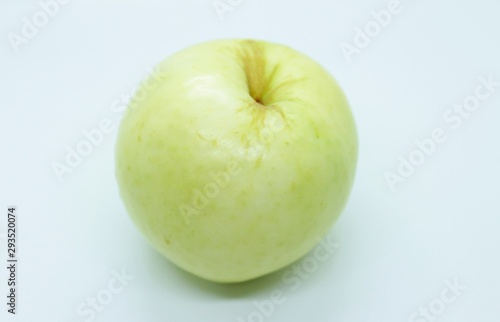 Green apple located on a white background