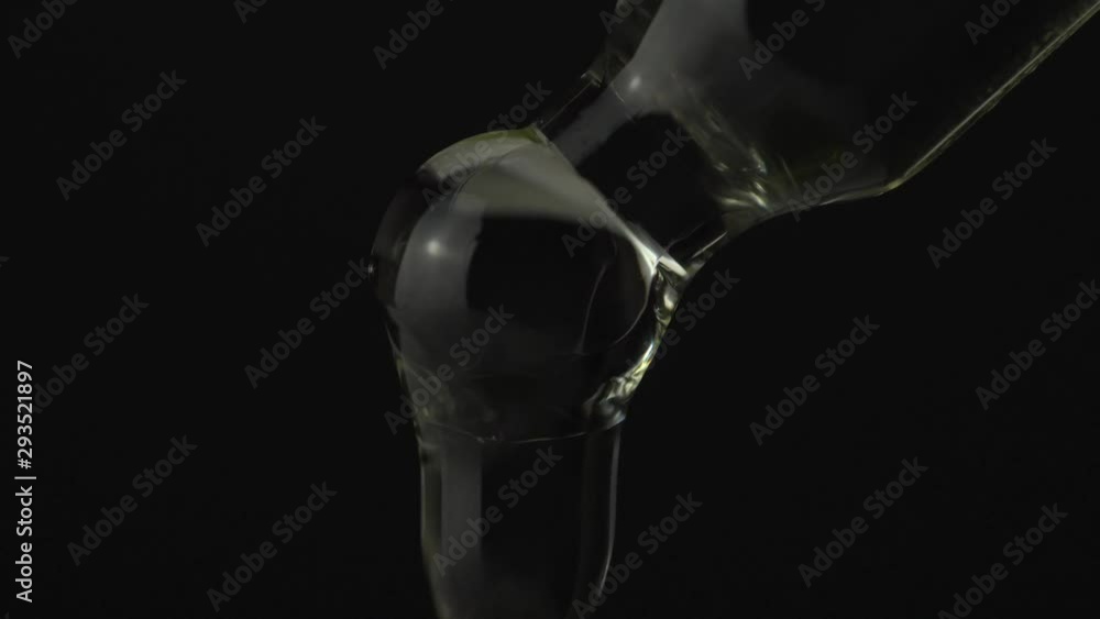 Super macro close up of droplet pipette dosing biological and ecological oil of the hemp plant. Pharmaceutical herbal cbd oil, organic pharma concept, on black background. Super macro close up of droplet pipette dosing biological and ecological oil of the hemp plant. Pharmaceutical herbal cbd oil, organic pharma concept, on black background.