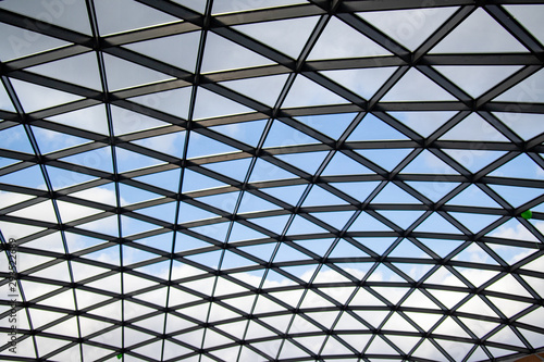 Glass roof against the blue sky.