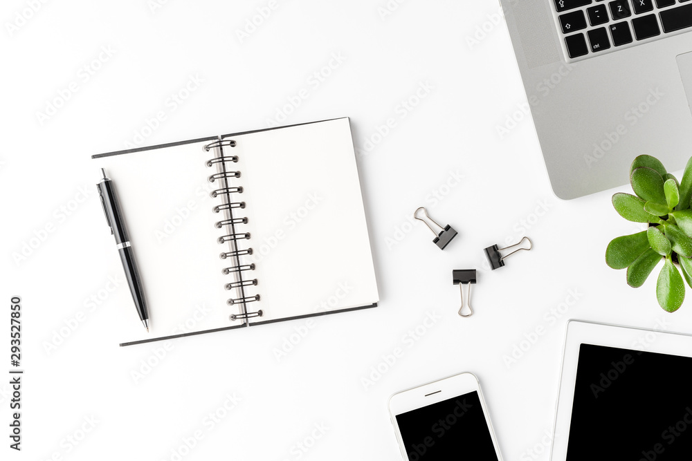 Modern workspace with business accessories and empty notebook. Office desktop Modern workspace with business accessories and empty notebook. Office desktop