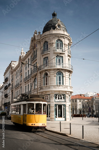 Yellow tram riding near Nova Banco building, downtown, Lisbon, Portugal