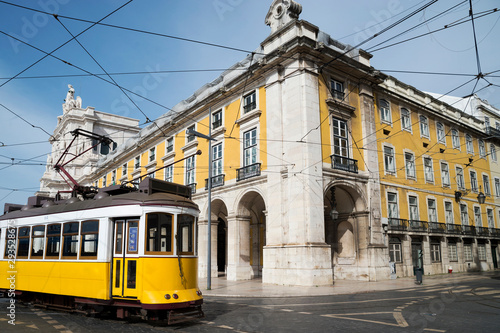 Public yellow tram at Praça do Comércio, Lisbon, Portugal