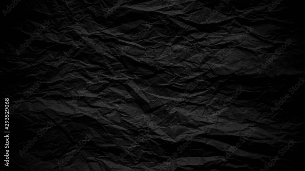 Dark black crumpled paper close up texture background Dark black crumpled paper close up texture background