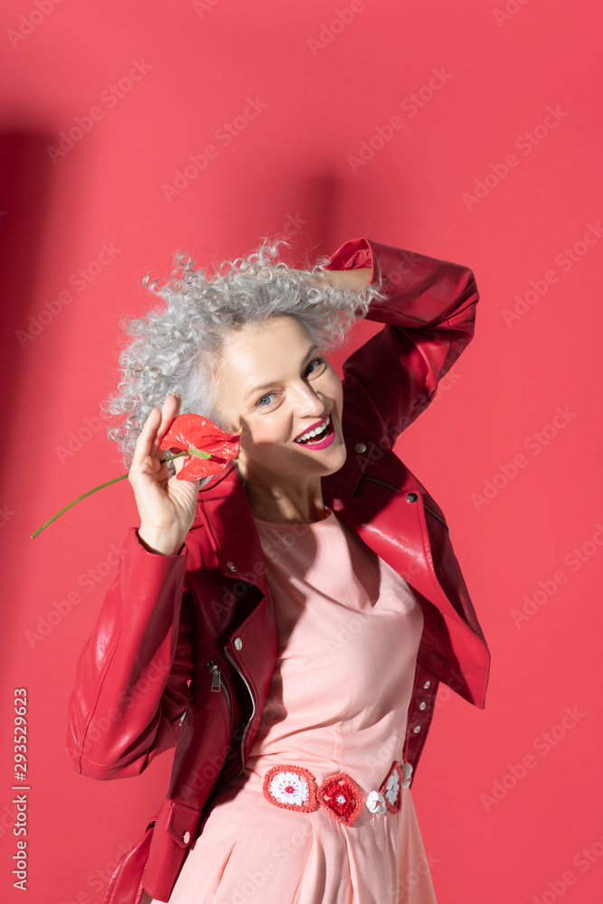 Fototapeta premium Woman wearing dress with stylish belt laughing while posing