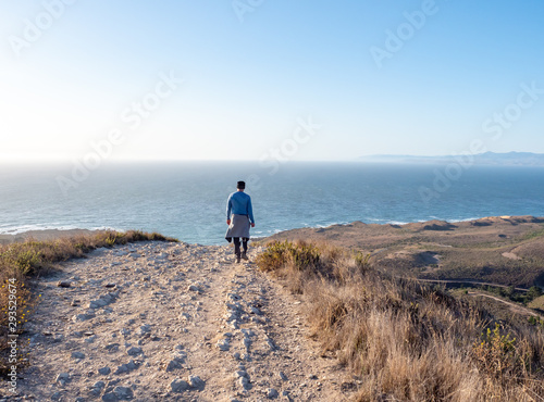 Walk along trail toward ocean in Montana de Oro State Park, Los Osos, California, USA