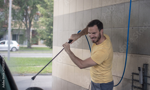 Go out to town. Man washing his car. photo