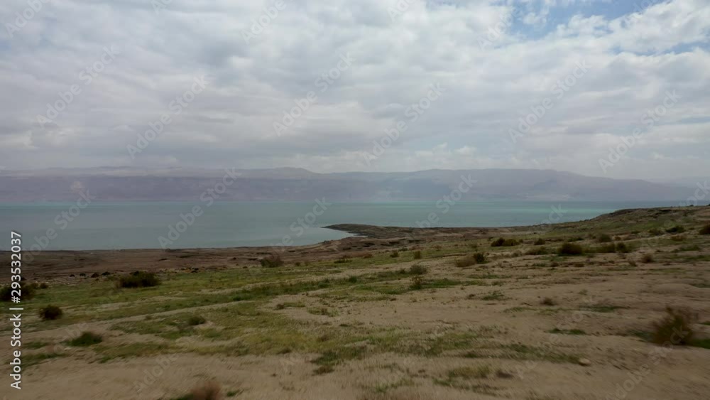 Aerial Dead sea desert greenish after rain, cloudy sky, drone shot Aerial Dead sea desert greenish after rain, cloudy sky, drone shot