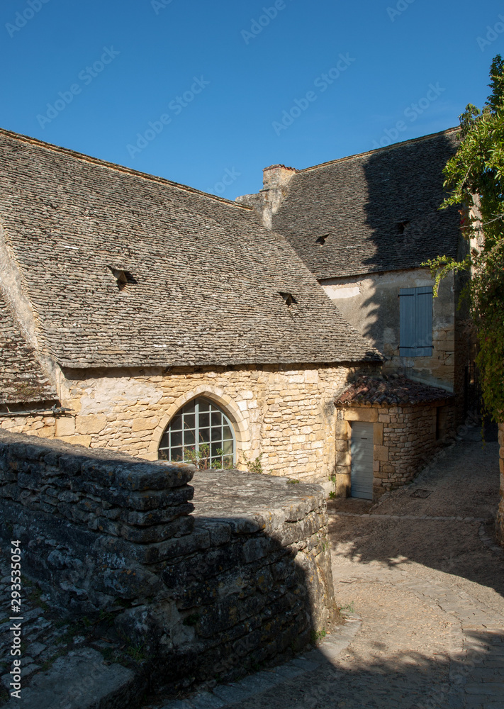  Typical French townscape with ancient housest and cobblestone street in the traditional town Beynac-et-Cazenac, France