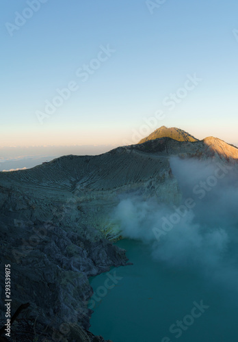 First light with fog. Sunrise on on the mountain Ijen Java ,Indonesia.