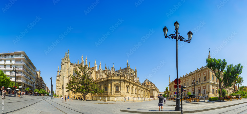 Triumph Square in front of the Royal Alcazar with a view of the Cathedral and Archivo de Indias. Panorama. Seville, Andalusia, Spain