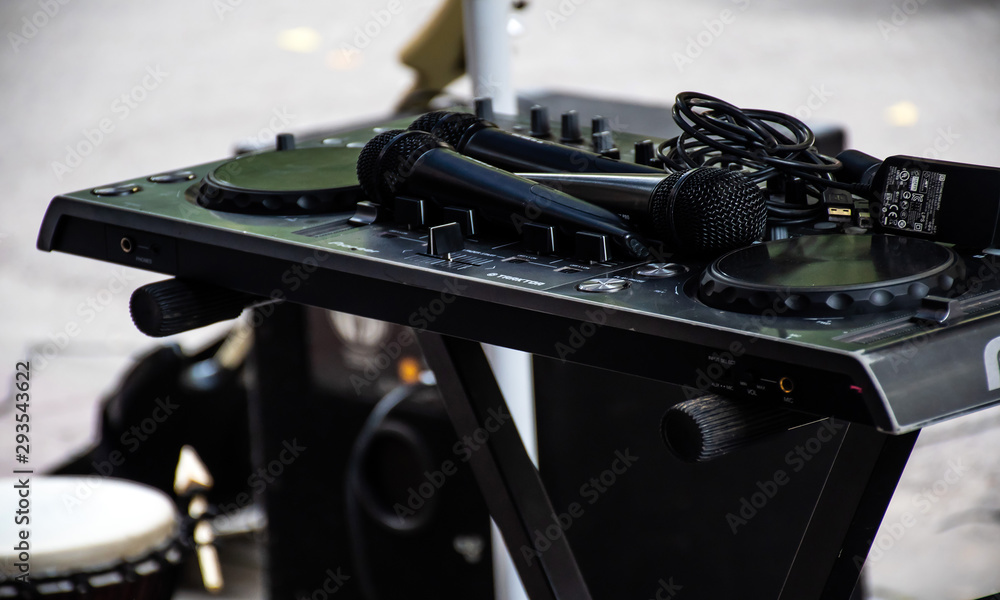 Fototapeta premium CD players and DJ console during the party
