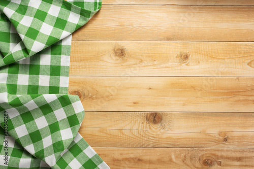cloth napkin at rustic wooden background, top view