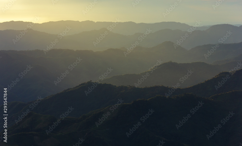 A view of diffused sun rays hitting a range of hills from the village of Hmuifang in Mizoram