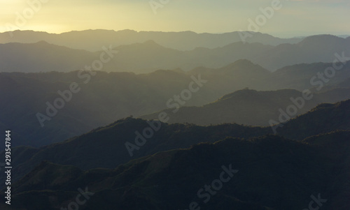 A view of diffused sun rays hitting a range of hills from the village of Hmuifang in Mizoram