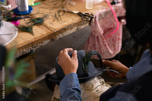 Woman working in a hat factory