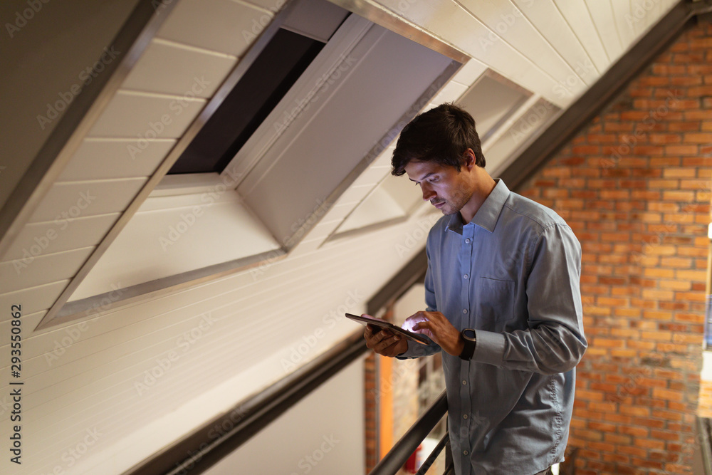 Young male business creative using tablet Young male business creative using tablet