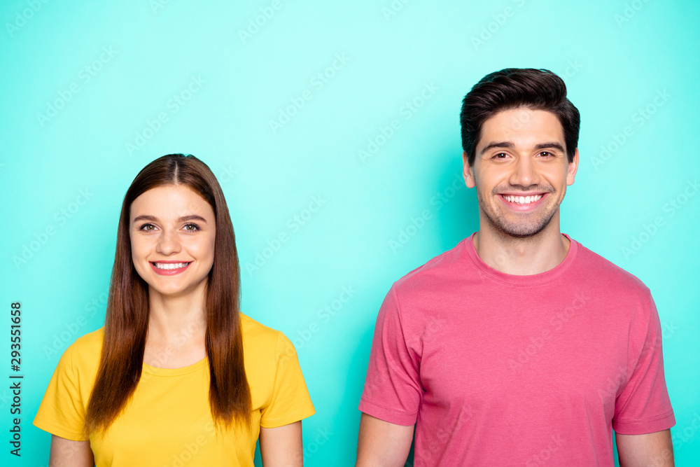 Close-up portrait of his he her she nice attractive lovely cheerful cheery couple smiling isolated over bright vivid shine vibrant green blue turquoise background