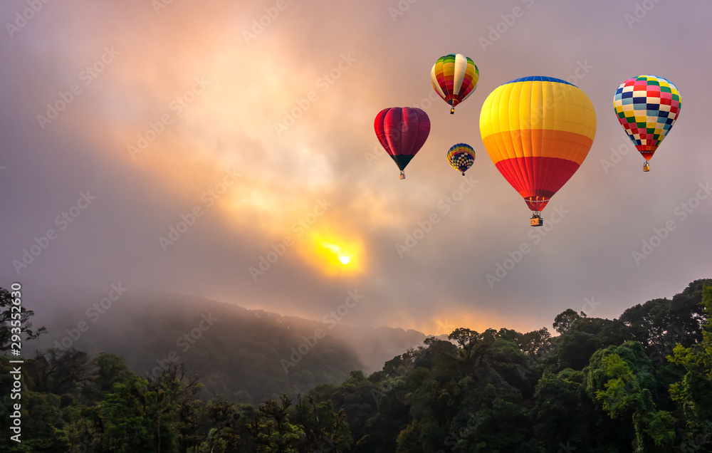 Colorful hot air balloons flying over Doi Inthanon National Park in sunrise time, Chiang Mai Province, Thailand.