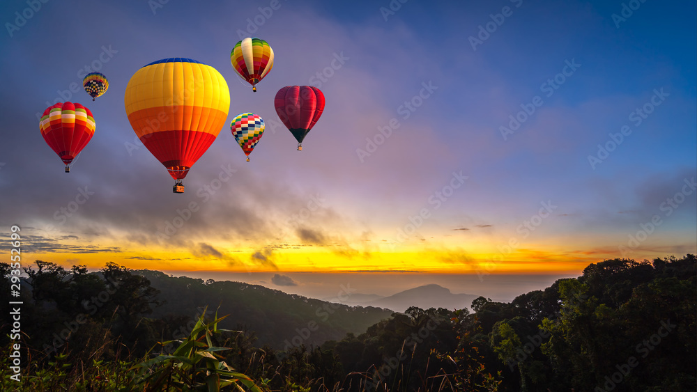 Colorful hot air balloons flying over Doi Inthanon National Park in sunrise time, Chiang Mai Province, Thailand.