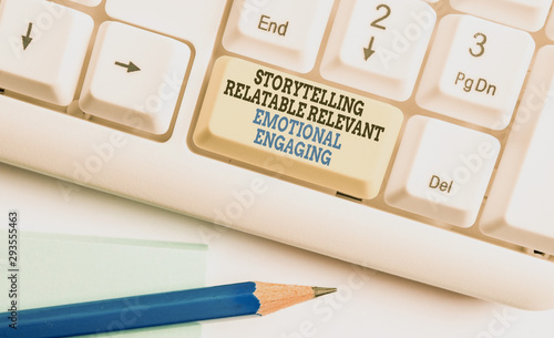 Writing note showing Story Telling relatablerele. Business concept for Storytelling Relatable Relevant Emotional Engaging White pc keyboard with note paper above the white background photo