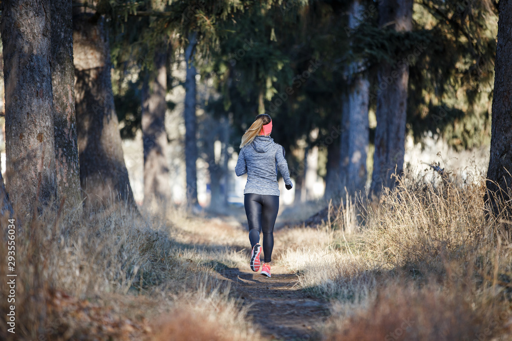 Young fitness woman running in the park Young fitness woman running in the park
