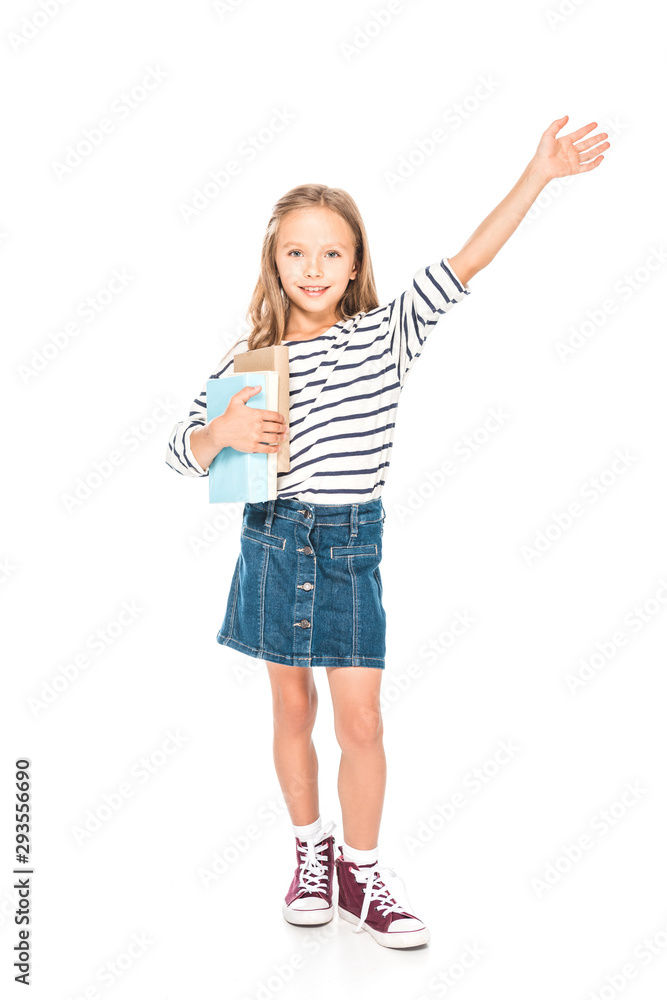 full length view of smiling kid with books isolated on white full length view of smiling kid with books isolated on white
