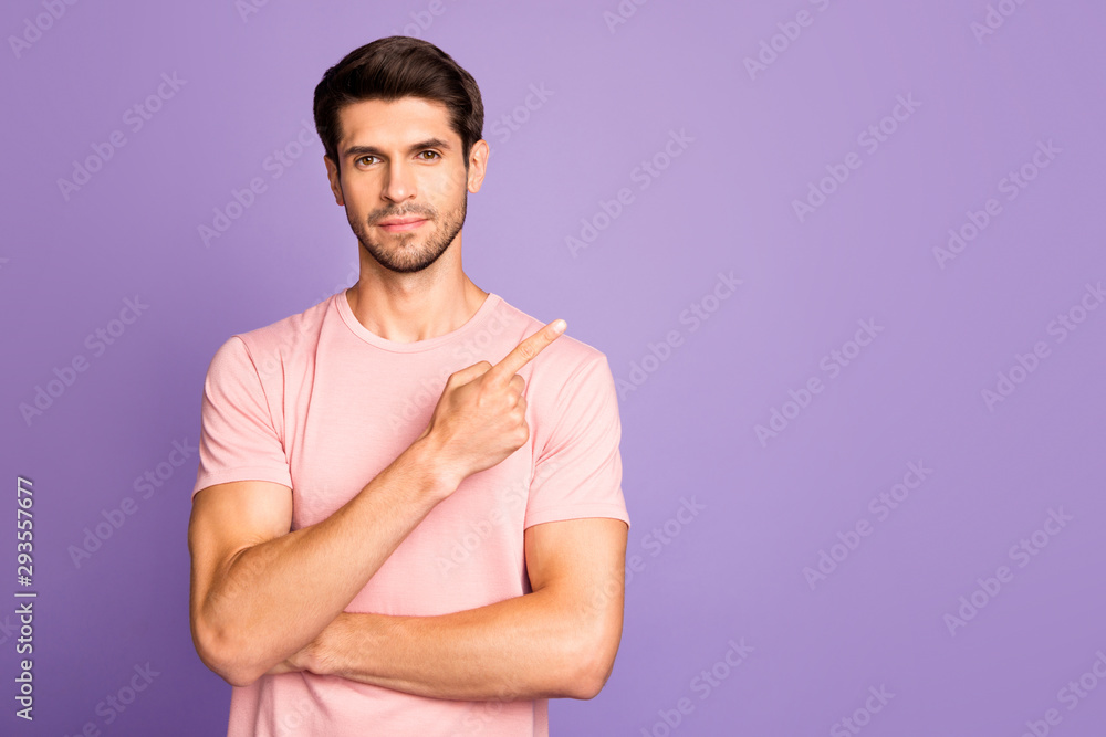 Portrait of his he nice attractive handsome brunet bearded guy wearing pink tshirt pointing forefinger aside follow subscribe isolated over violet purple lilac pastel color background Portrait of his he nice attractive handsome brunet bearded guy wearing pink tshirt pointing forefinger aside follow subscribe isolated over violet purple lilac pastel color background
