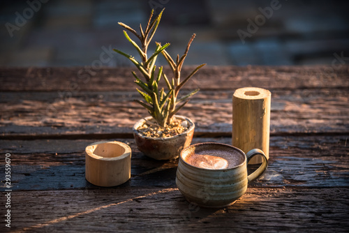 Evening sun shining coffee on an old wooden table