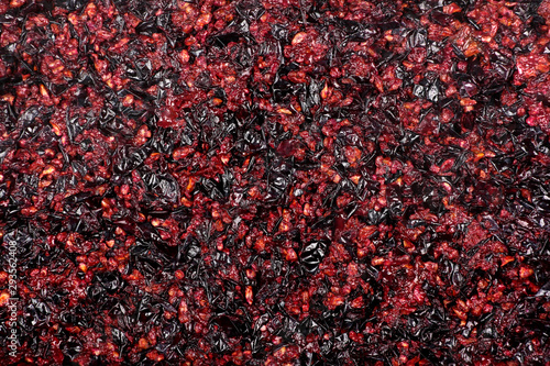 Pressed grape pomace, seeds and skins. Winemaking background. photo