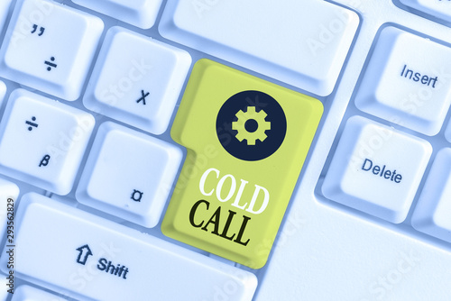 Conceptual hand writing showing Cold Call. Concept meaning Unsolicited call made by someone trying to sell goods or services White pc keyboard with note paper above the white background