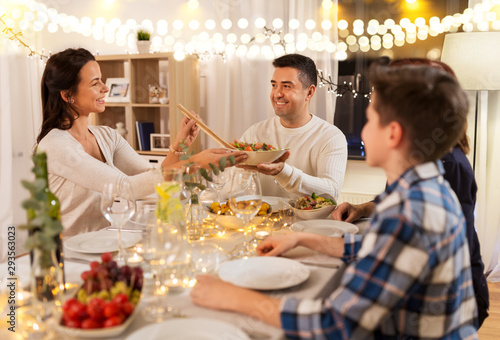 celebration, holidays and people concept - happy family having dinner party at home