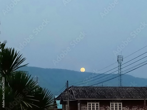 Full moon over the mountain with beautiful evening sky 