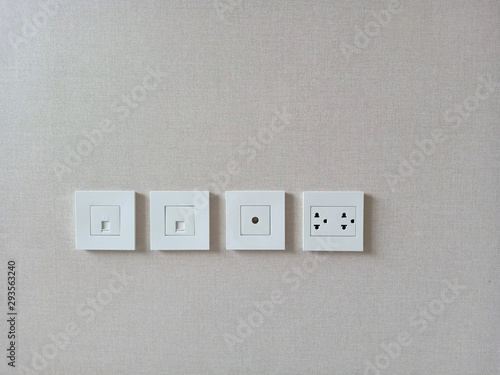Row of electric outlet set in home, apartment, TV outlet , cable outlet and Electronic plug, close up with blank space grey background