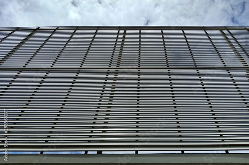 Angle view of steel fence against the sky