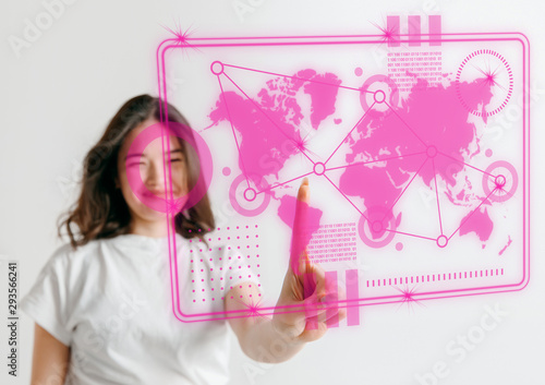 Modern technologies. Young asian woman's touching virtual reality in neon light on pink background. Concept of human emotions, facial expression, modern gadgets and technologies. Copyspace. © master1305