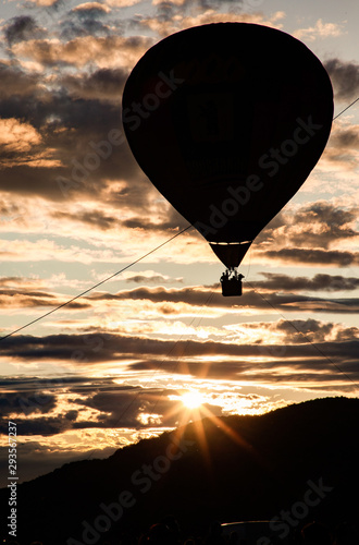 hot air balloons flying at sunset - live your dream, freedom and adrenaline concept