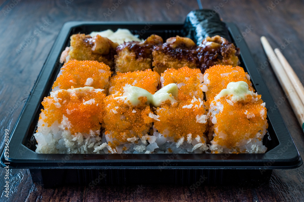 Sushi Set in Plastic Container Box / Package. California Roll, New York Roll, Boom Roll, Ginger, Wasabi and Soy Sauce. Sushi Set in Plastic Container Box / Package. California Roll, New York Roll, Boom Roll, Ginger, Wasabi and Soy Sauce.